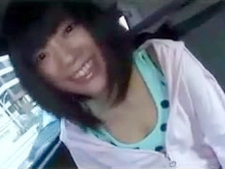 Panty-clad Asian babe rubs her wet pussy in front of the camera